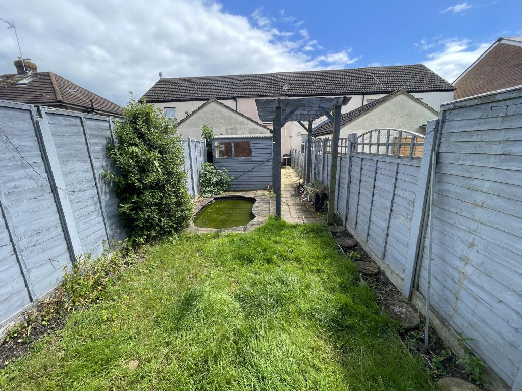 Lot: 162 - MID-TERRACE HOUSE IN NEED OF REFURBISHMENT - outside image from bottom of garden facing back towards house